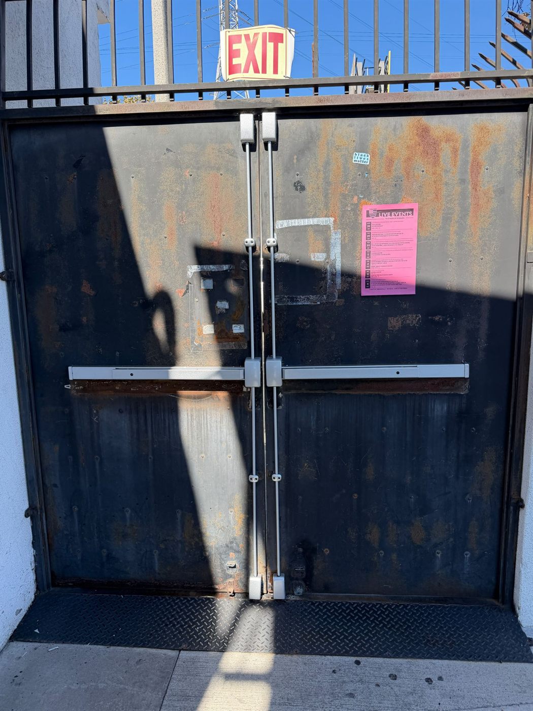 Vertical rod exit devices installed on a pair of steel double doors