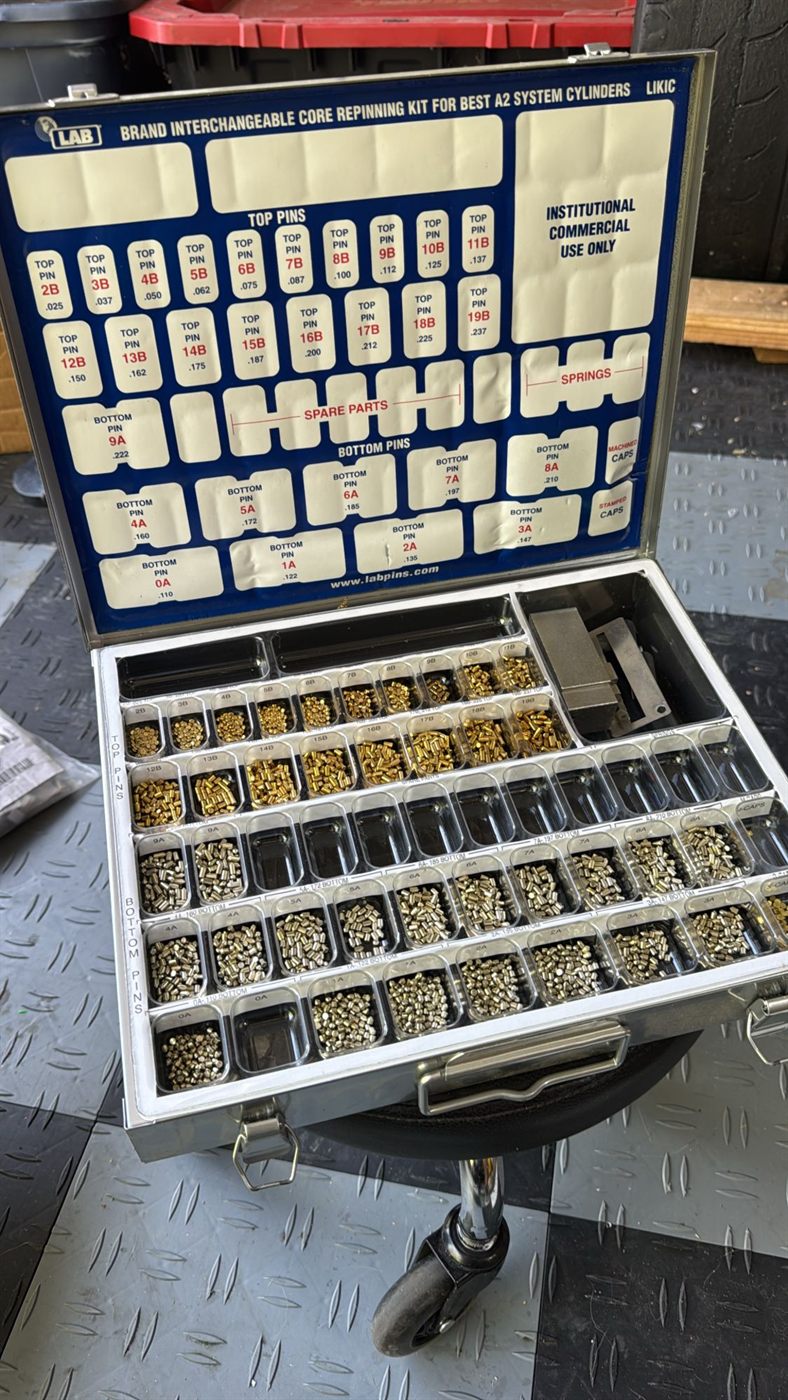 Open rekeying kit with sorted brass and silver lock pins