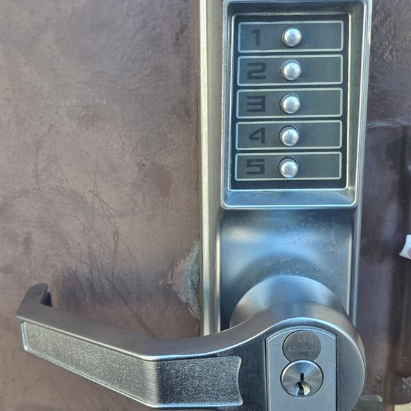 Mechanical push-button keypad lever lock on a metal door