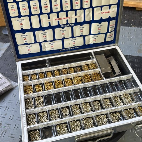 Open rekeying kit with sorted brass and silver lock pins